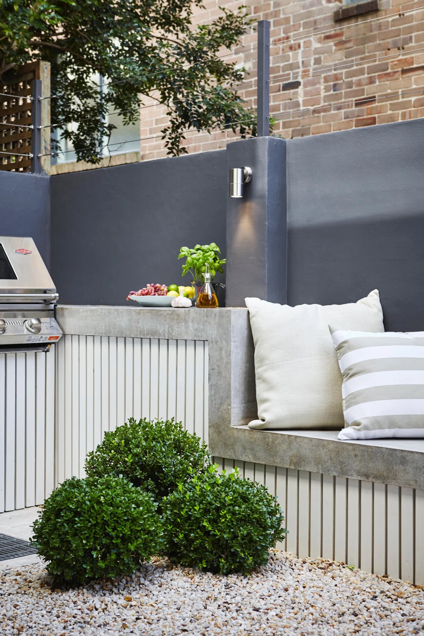 Completed outdoor kitchen with a poured concrete benchtop