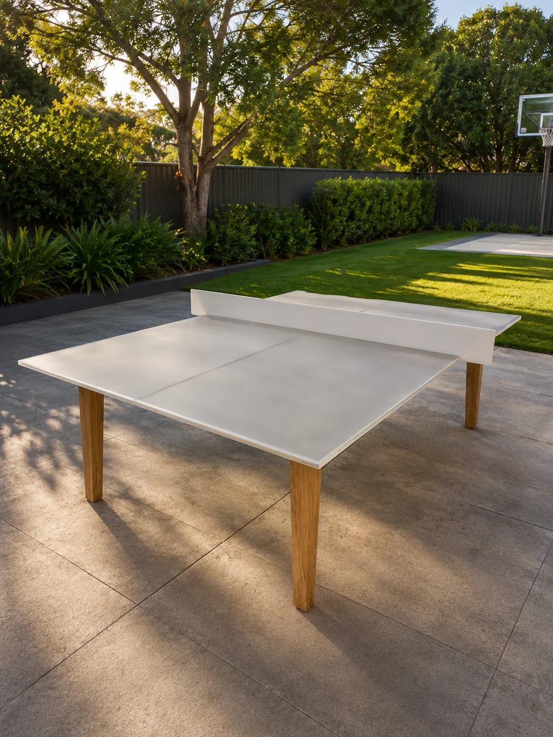 Sculptural concrete table set within a landscaped garden